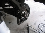 Quarter axle hanging free in the steering knuckle